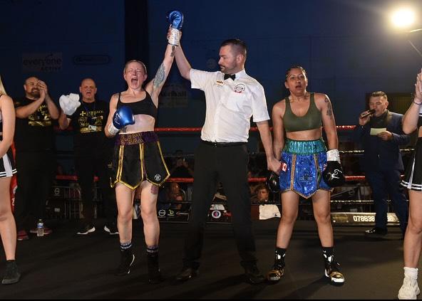 Amy Greatorex having her hand raised by the ref after her fight with Sangeeta Birdi.