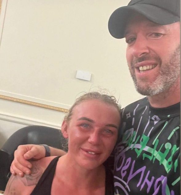 Ashleigh Johnson posing for a photo with her coach Enzo Maccarinelli.