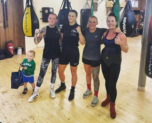 Ashleigh Johnson posing for a photo with her sparring partners, which includes Bec Connolly and Gemma Ruegg.
