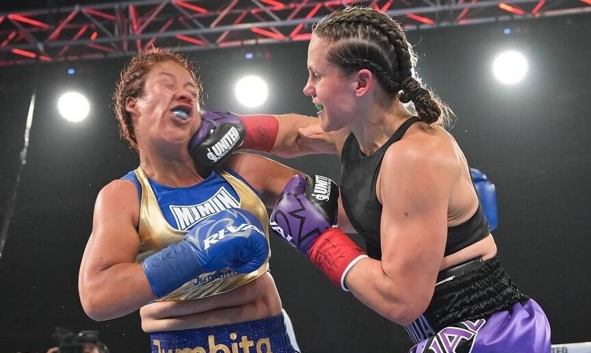 Melinda Watpool punching her opponent.